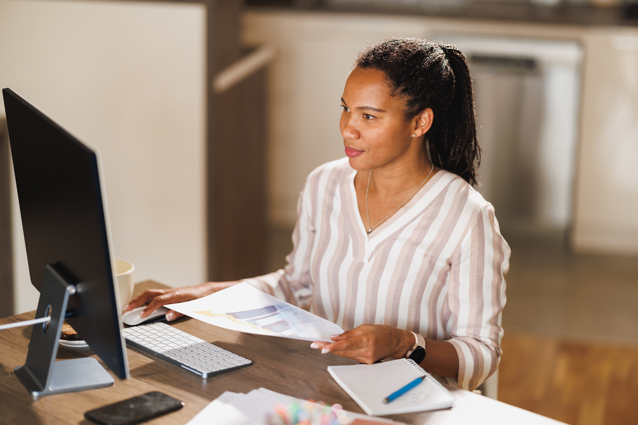 Compliance professional reviewing affordable housing files